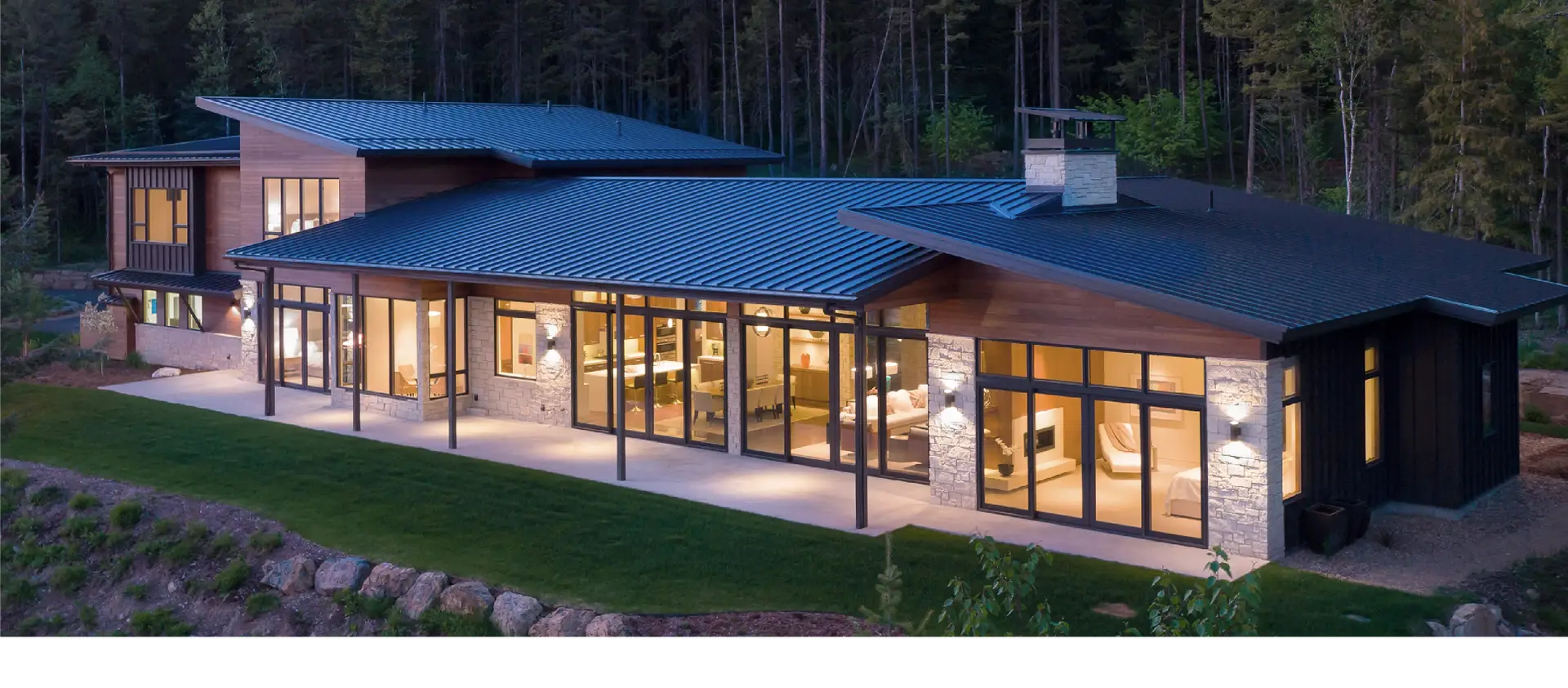 Large modern home in the countryside displaying window products